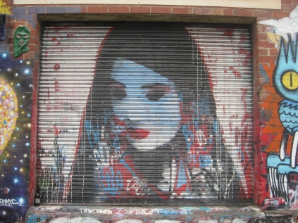 graffiti walk Footscray woman downcast eyes geisha with her hair down