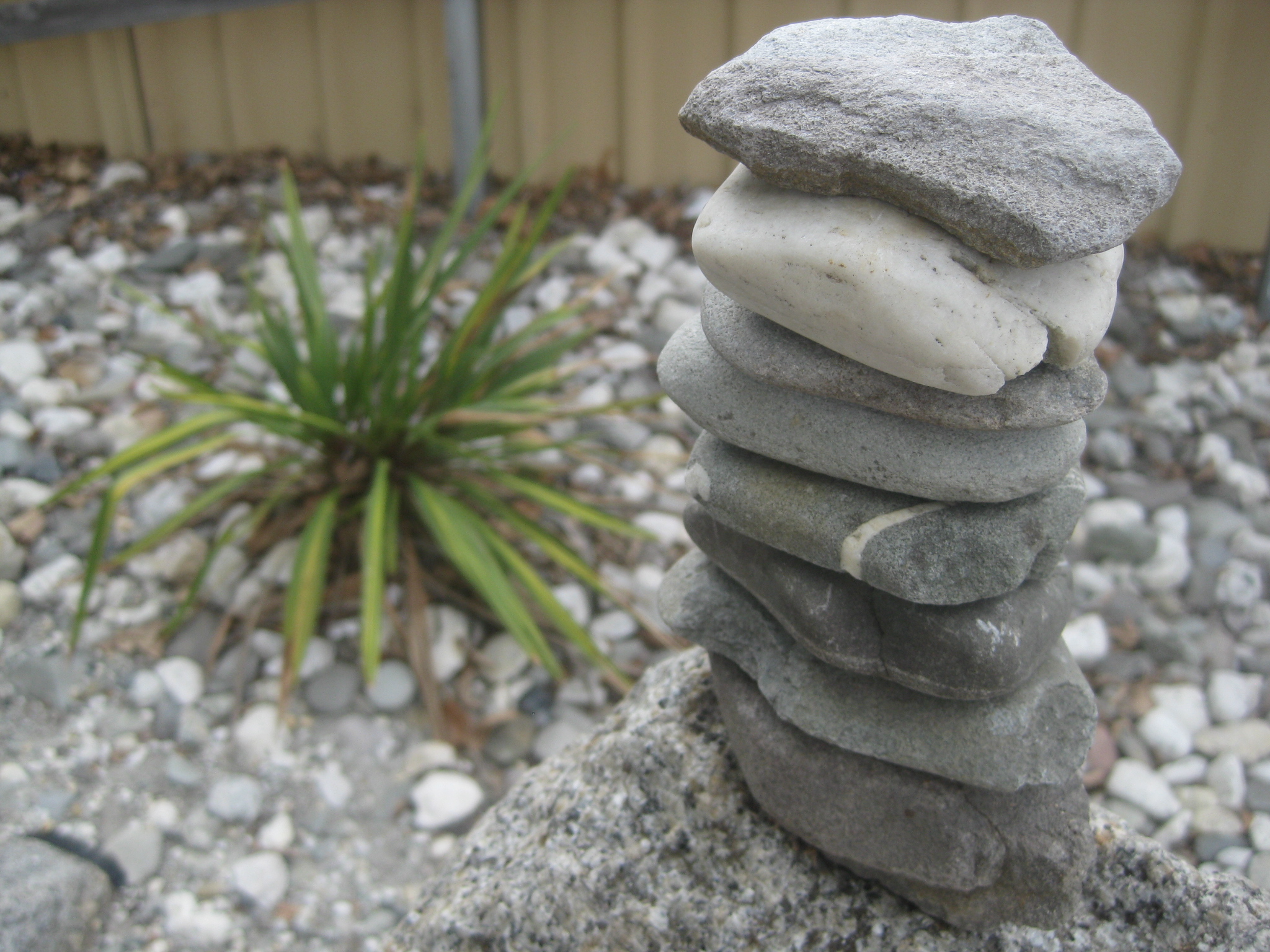 carefully balanced stack of rocks art andy goldsworthy